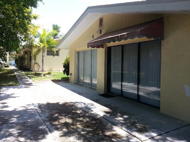 View of Cottage patio and back of first tri-plex b