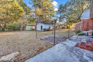 View of yard featuring an outdoor structure and a 