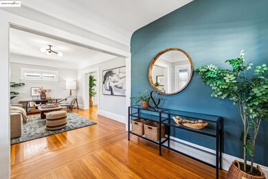 Living area with hardwood / wood-style floors and baseboards