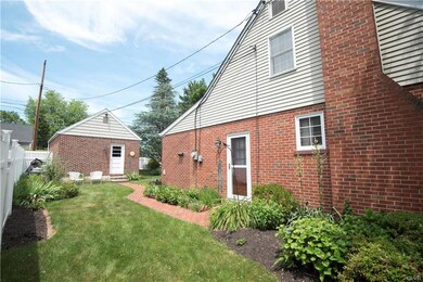 SIDE YARD - BRICK PATHS - GARAGE - DOORS OPENS INT