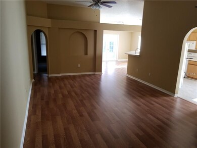 Open spaces connect living area, kitchen and dinin
