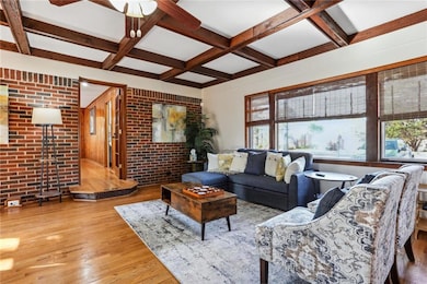 Living room with light hardwood / wood-style floor