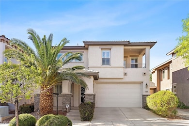 View of front facade featuring a garage, stucco si