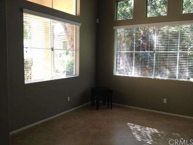 Living room with large window looking out onto fro