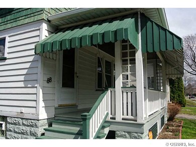 Exterior Front. Welcoming Shades front porch