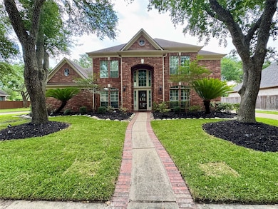 A neatly trimmed and pristine front yard.