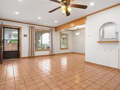 Spare room featuring ornamental molding, baseboar