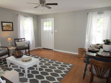 The Living Room has wood laminate flooring with ar