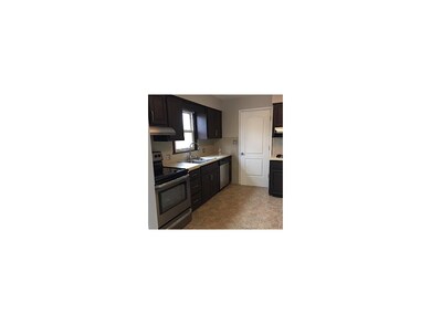 Kit Showing Electric Range, Etc