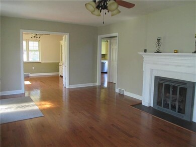 Living Room with view of dining room and kitchen.
