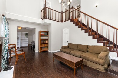 High ceilings and dark wood floors make the room f
