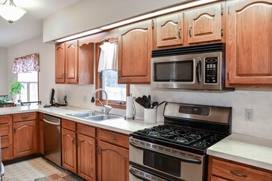 Stainless steel appliances and a breakfast bar!