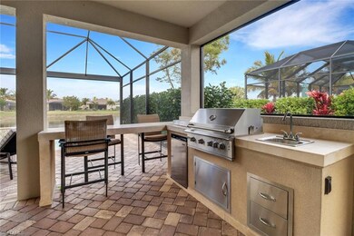 View of patio featuring a grill, exterior kitchen,