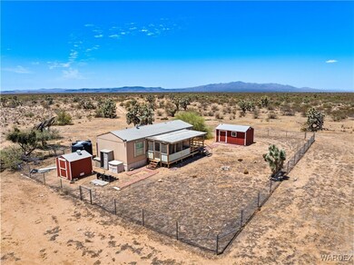 Birds eye view of property with a mountain view an