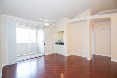Family room looking on to outdoor patio and outdoor storage area.