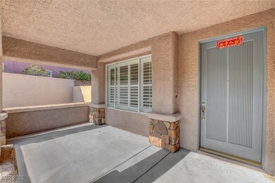 Doorway to property featuring stucco siding