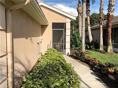 Walkway to front door featuring screened entrance.