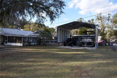 RV Carport with a shed behind on the back.