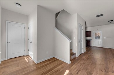 Hallway featuring light hardwood / wood-style floo