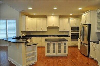 Bright open gourmet Kitchen with breakfast bar and
