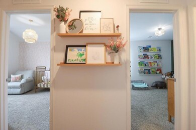 Hallway with carpet flooring
