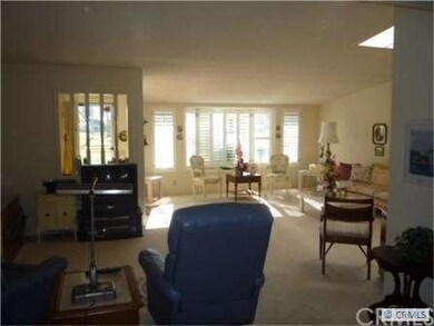 View from kitchen into Dining El (used as TV room)