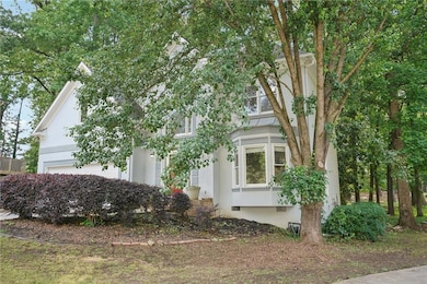 View of side of home featuring stucco siding