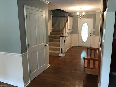 Foyer and wide steps to upstairs