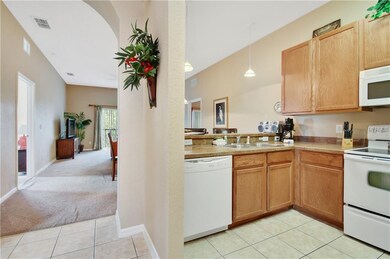 View of the kitchen and the open living space behi