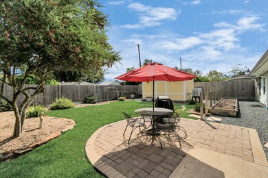 Fully fenced back yard w large storage shed