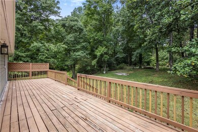 Wooden deck featuring a lawn