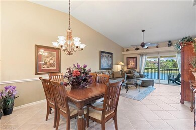 Tiled dining room featuring high vaulted ceiling a