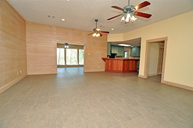 This photo showcases a spacious open-plan living a