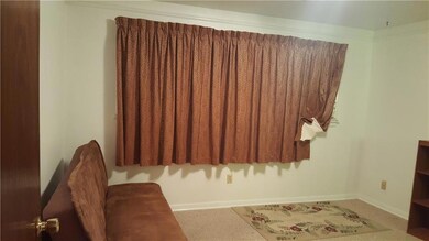 Front bedroom has attached half bath