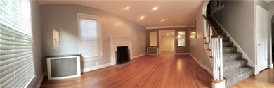 main living room with fireplace open to step down 