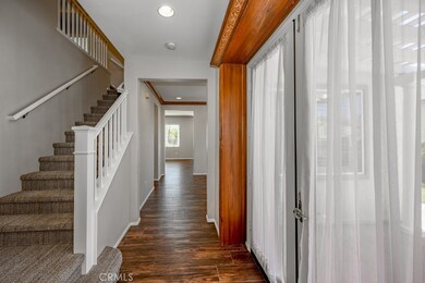 The exit to a second patio and the beautiful staircase to 5 bedrooms upstairs.