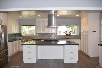 Open Kitchen to living room and dinning room.  Grey Quartz Countertops