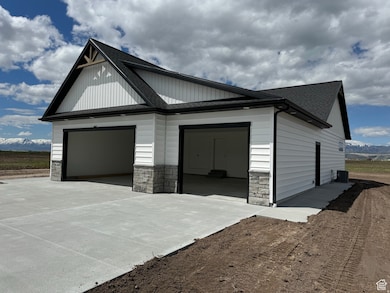 Garage featuring a mountain view and concrete driveway