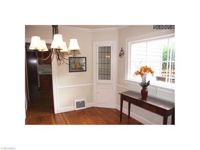 The hardwood floors continue into the dining room.
