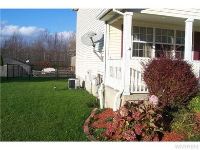Exterior Front Nicely landscapped yard, central ai