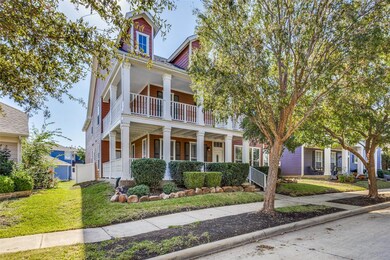 View of front facade with a front yard and covered