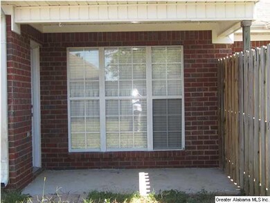 COVERED PATIO OVERLOOKING FENCED BACK