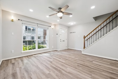 RECESSED LIGHTING, LIGHT FIXTURES, WALL SCONCES & NEW FAN ENHANCE THIS CHEERFUL LIVING ROOM!