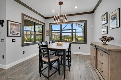 Dining room with a notable chandelier, crown moldi