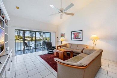 Tiled living room with high vaulted ceiling and ce