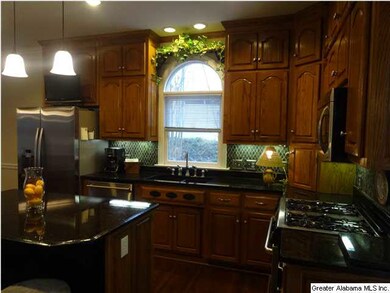 Granite counter tops, tile back splash, under cabi