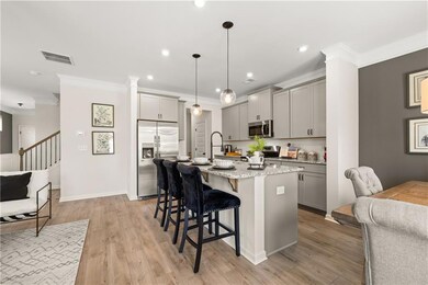 Kitchen with pendant lighting, appliances with sta