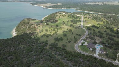 View of property location with a nearby body of w