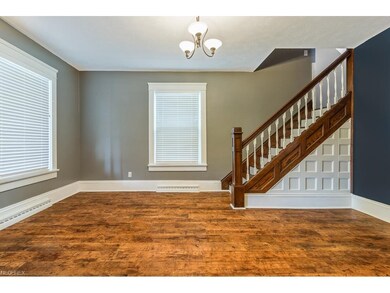 Foyer front entry and formal Y staircase that join