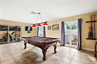 View of screened porch and pool from game/bonus ro